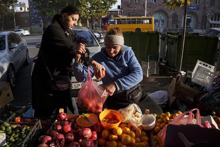 A vendor sells fruit at street market in Yerevan, Armenia. Photo: Pavel Golovkin / AP / Scanpix / LETA