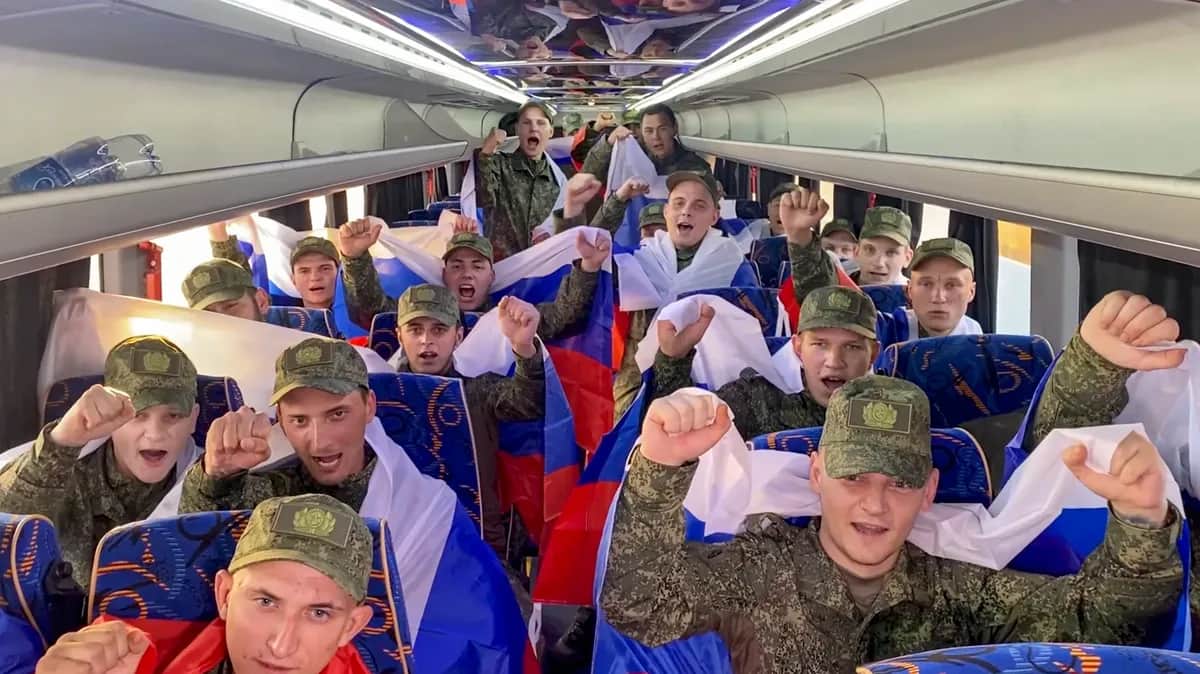 A screenshot taken from a handout video provided by the Russian Defence Ministry shows Russian prisoners of war cheering after landing in the Moscow region following a prisoner swap on 9 June 2025.&nbsp;Photo: EPA-EFE/RUSSIAN DEFENCE MINISTRY