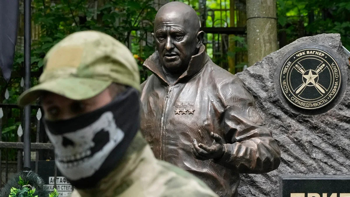 A man wearing Wagner gear at Prigozhin’s grave in St. Petersburg in June. Photo: Dmitry Lovetsky / AP Photo / Scanpix / LETA