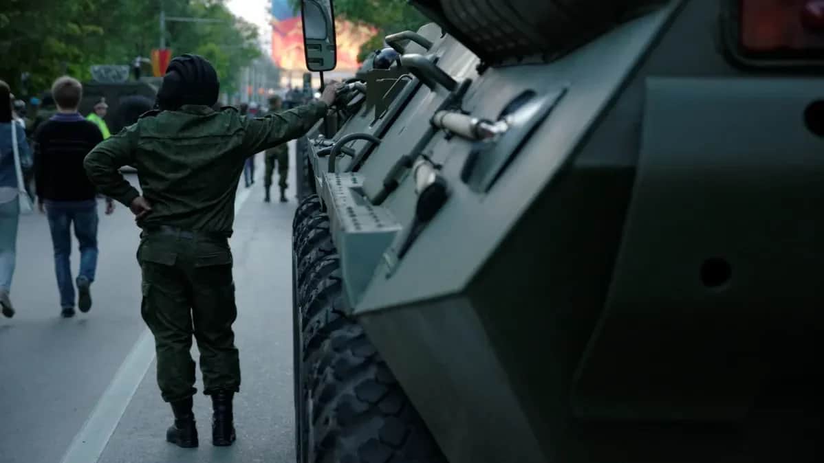 Russian soldier near a BTR-80 armoured vehicle. Photo: Getty Images