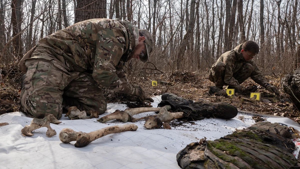Ukrainian volunteers lay out fragments of bodies found in the Kharkiv region on 12 March 2025. Photo: Gwara Media / Hnat Holyk / Scanpix / LETA
