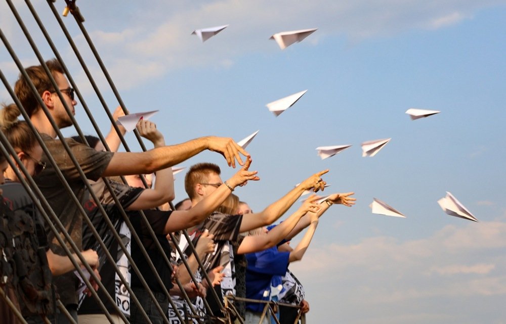 Local people launch paper airplanes during a Last Flight mourning ceremony on the tenth anniversary of the MH17 crash near the village of Hrabove, in the Donetsk region, 17 July 2024. Photo: EPA/ALESSANDRO GUERRA
